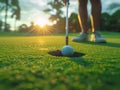 Golfer putting golf ball on the green grass, golf player putting golf ball into hole Royalty Free Stock Photo