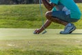 Golfer putting golf ball. Unrecognizable Royalty Free Stock Photo