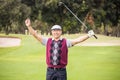 Golfer raising his arms Royalty Free Stock Photo