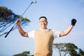 Golfer raising his hands Royalty Free Stock Photo