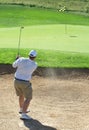 Golfer in the sand bunker Royalty Free Stock Photo