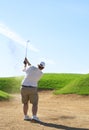 Golfer in the sand bunker Royalty Free Stock Photo