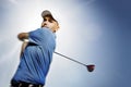 Golfer shooting a golf ball Royalty Free Stock Photo