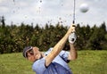 Golfer shooting a golf ball Royalty Free Stock Photo