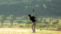 Golfer sport course golf ball fairway. People lifestyle man playing game golf tee off on the green grass. Royalty Free Stock Photo