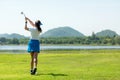 Golfer sport course golf ball fairway. People lifestyle woman playing game golf and hitting go on green Royalty Free Stock Photo