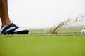 Golfer striking Royalty Free Stock Photo