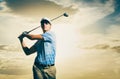Golfer at sunset Royalty Free Stock Photo