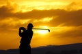 Golfer sunset sw Royalty Free Stock Photo