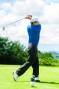 Golfer swinging his gear and hit the golf ball