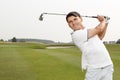 Golfer swinging his niblick out Royalty Free Stock Photo