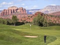 A Golfer Takes a Chip Shot from the Rough Royalty Free Stock Photo