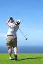 Golfer on the tee box Royalty Free Stock Photo