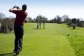 Golfer tee off Royalty Free Stock Photo