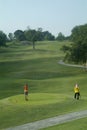 Golfer after tee-off Royalty Free Stock Photo