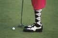 Golfer wearing pink golf pants