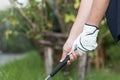Golfer wearing white glove holdiing golf club Royalty Free Stock Photo