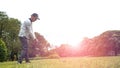 Golfers approach shot with iron from fairway, The principle of golf Royalty Free Stock Photo