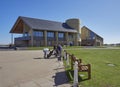 Golfers getting ready to play in front of the New Carnoustie Golf centre and Clubhouse, at the Open Championship Course.