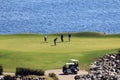 Golfers on ocean green in Mexico Royalty Free Stock Photo
