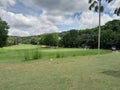 golfers are playing on the batam city golf course with green grass that looks so beautiful and amazing. Royalty Free Stock Photo