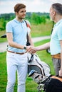 Golfers shake hands with each other Royalty Free Stock Photo
