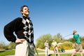 Golfers Watching Other Golfer Teeing Off Royalty Free Stock Photo