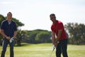 Golfing buddies. two handsome men playing a game of golf. Royalty Free Stock Photo