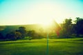 And so the golfing season begins. a flag on a golf course. Royalty Free Stock Photo