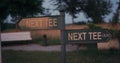 Golfing sign show information text at sunset nature green field park outdoors. Royalty Free Stock Photo