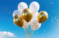 Golg and white helium balloons fly off into the blue sky. Declaration of love, Holidays, birthdays, surprise, party