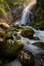 Gollinger Waterfall in Golling an der Salzach near Salzburg, Austria. Gollinger Wasserfall with mossy rocks and green trees,