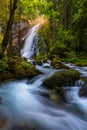 Gollinger Waterfall in Golling an der Salzach near Salzburg, Austria. Gollinger Wasserfall with mossy rocks and green trees,