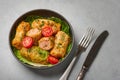 Golubtsi or golabki on black bowl on concrete table top. Stuffed cabbage rolls dish of russian, polish, ukrainian cuisine. Royalty Free Stock Photo