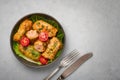 Golubtsi or golabki on black bowl on concrete table top. Stuffed cabbage rolls dish of russian, polish, ukrainian cuisine. Royalty Free Stock Photo