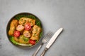 Golubtsi or golabki in black bowl on concrete table top. Stuffed cabbage rolls dish of russian, polish, ukrainian cuisine. Royalty Free Stock Photo