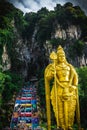 Close up portrait of Lord Murugan Statue in foothills of limestone outcrop, Batu Caves Gombak