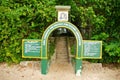 Gombe Stream National Park sign surrounded by vegetation