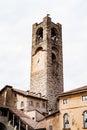 Gombito Tower with a clock on the facade in Citta Alta. Bergamo, Italy Royalty Free Stock Photo