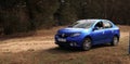 GOMEL, BELARUS - 8 April 2017: Car Renault Logan blue parked in a pine forest