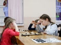 GOMEL, BELARUS - DECEMBER 29, 2019: Checkers chess competition among girls and boys Royalty Free Stock Photo