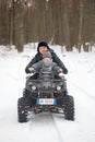 GOMEL, BELARUS - JANUARY 15, 2017: Country winter family holiday. Quad biking in the winter.