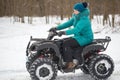 GOMEL, BELARUS - JANUARY 15, 2017: Country winter family holiday. Quad biking in the winter.