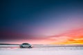 Volkswagen Polo Car Sedan Parking On A Roadside Of Country Road On A Background Of Dramatic Sunset Sky At Winter Season Royalty Free Stock Photo