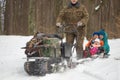 GOMEL, BELARUS - JANUARY 15, 2017: Winter fun. Family sledging hunting snowmobile. Royalty Free Stock Photo