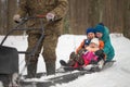 GOMEL, BELARUS - JANUARY 15, 2017: Winter fun. Family sledging hunting snowmobile. Royalty Free Stock Photo