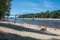 People relaxing on the beach of river Sozh in summer.