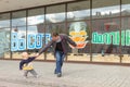 Gomel, Belarus - MAY 3, 2015: Father and son hold hands. a fun game on a city street.
