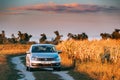 Volkswagen Polo Car Sedan Parking Near Country Road In Autumn Field In Sunny Evening. Royalty Free Stock Photo