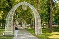 Gomel, Belarus. Young Woman Passing Through Decorative Arches